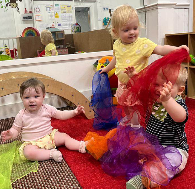 3 babies playing at de lacey nursery